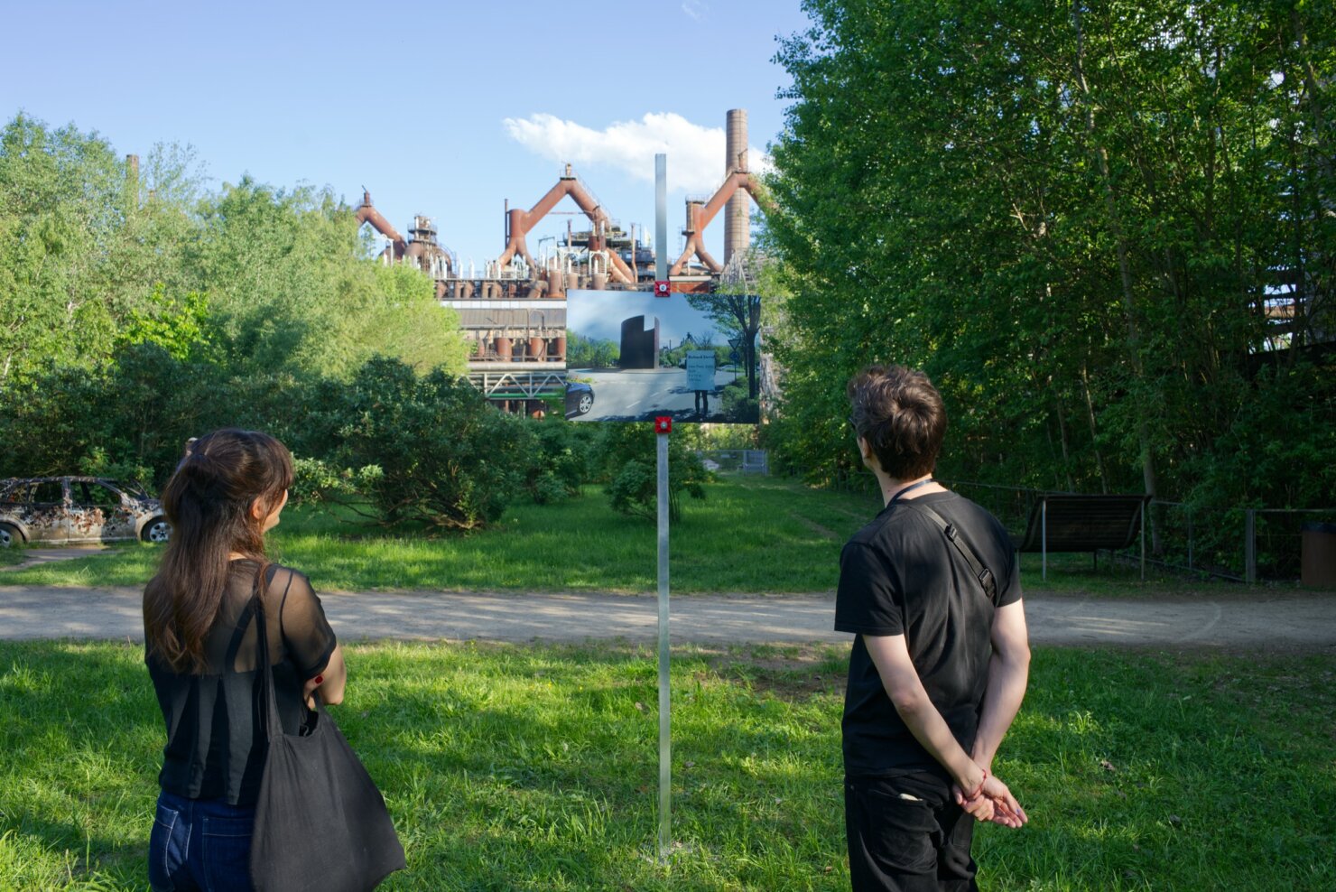 Matthieu Martin, Kreisverkehr, monumental artwork label deployed near public sculpture, Völklingen region, 2026