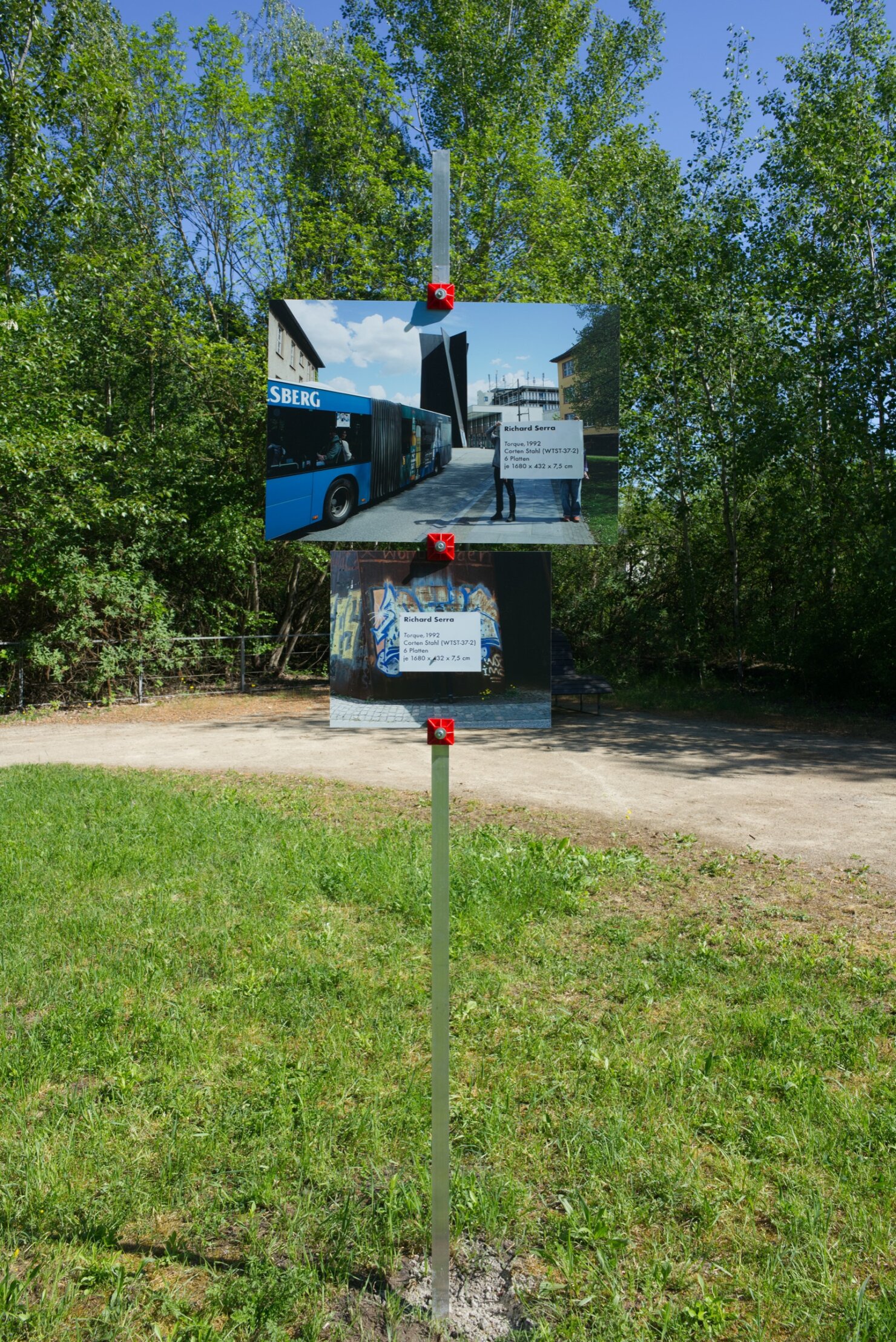 Matthieu Martin, Kreisverkehr, monumental artwork label deployed near public sculpture, Völklingen region, 2026