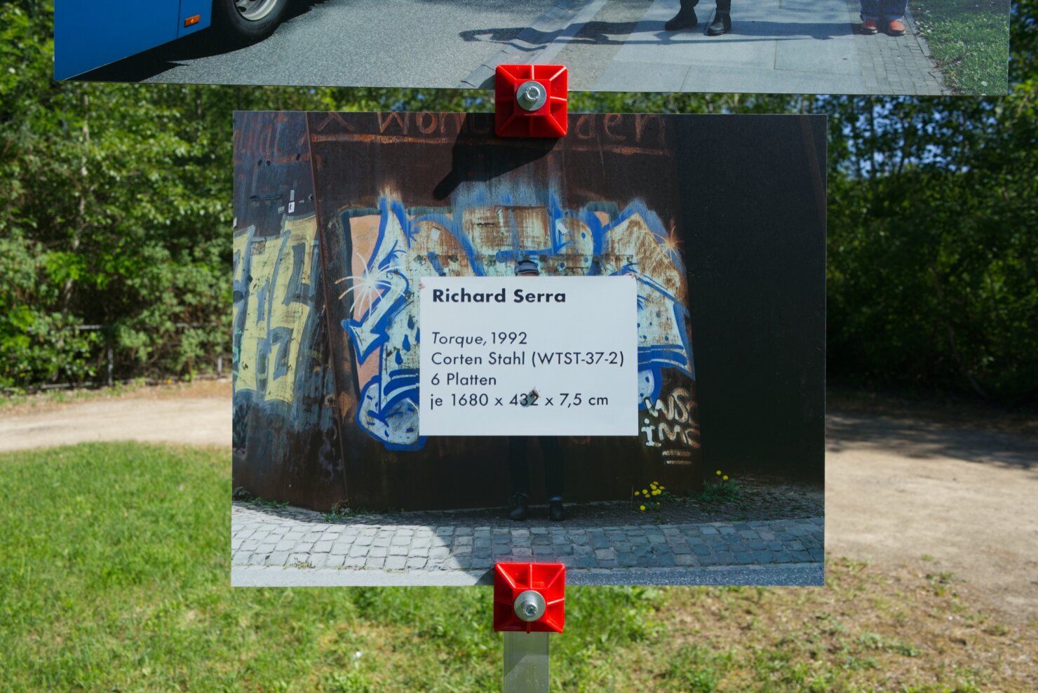 Matthieu Martin, Kreisverkehr, monumental artwork label deployed near public sculpture, Völklingen region, 2026